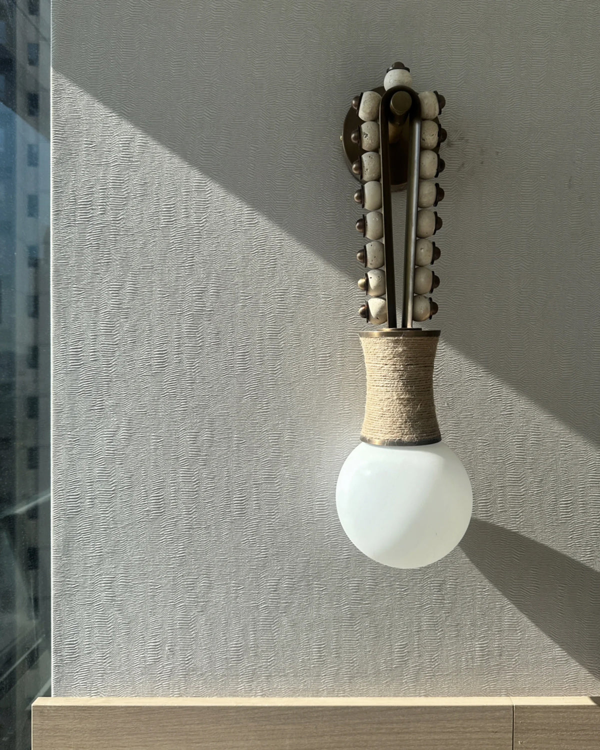 Earthen Rhythm Necklace Wall Light